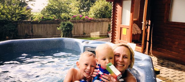 A mother and her sons in a hot tub
