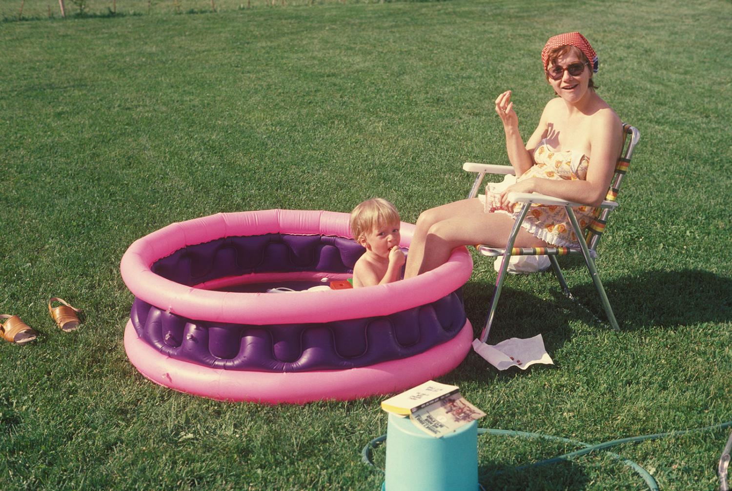 Mother and son together in a kiddie pool
