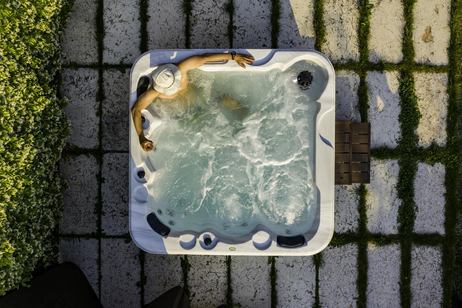 Man relaxing in a ph balanced hot tub